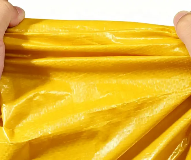 China Yellow Tarpaulin Fabric with Metal Grommets Waterproof Outdoor Use Plain Woven Heavyweight Manufacturer, Supplier
