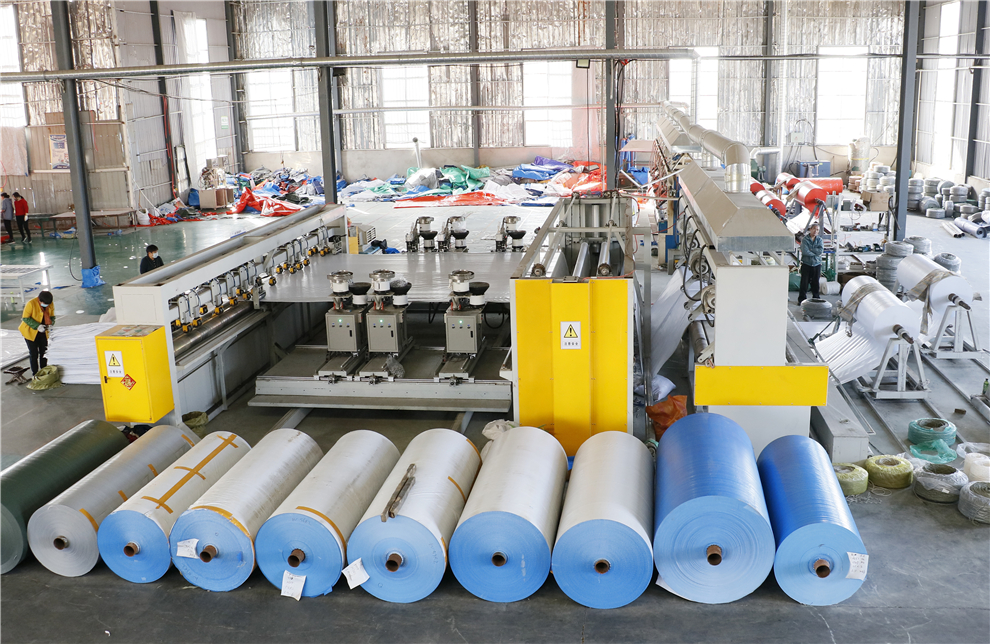 Star Tarpaulins production workshop with coated tarpaulin rolls in Linyi Shandong