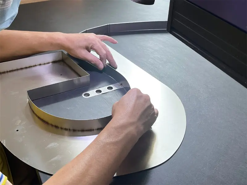 Non-illuminated Metal Letter Signs — brushed stainless steel and aluminum dimensional letters for professional signage