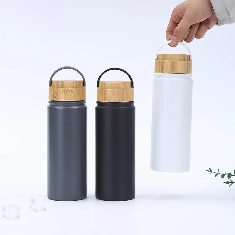 China Resuable 500ml Double Wall Stainless Steel Water Bottle with Bamboo Lid Vacuum Insulated Travel Thermos with Handle Suppliers, Factory