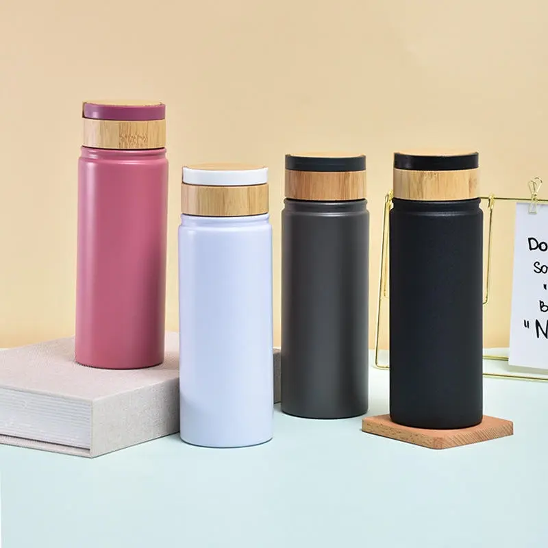 China Resuable 500ml Double Wall Stainless Steel Water Bottle with Bamboo Lid Vacuum Insulated Travel Thermos with Handle Suppliers, Factory