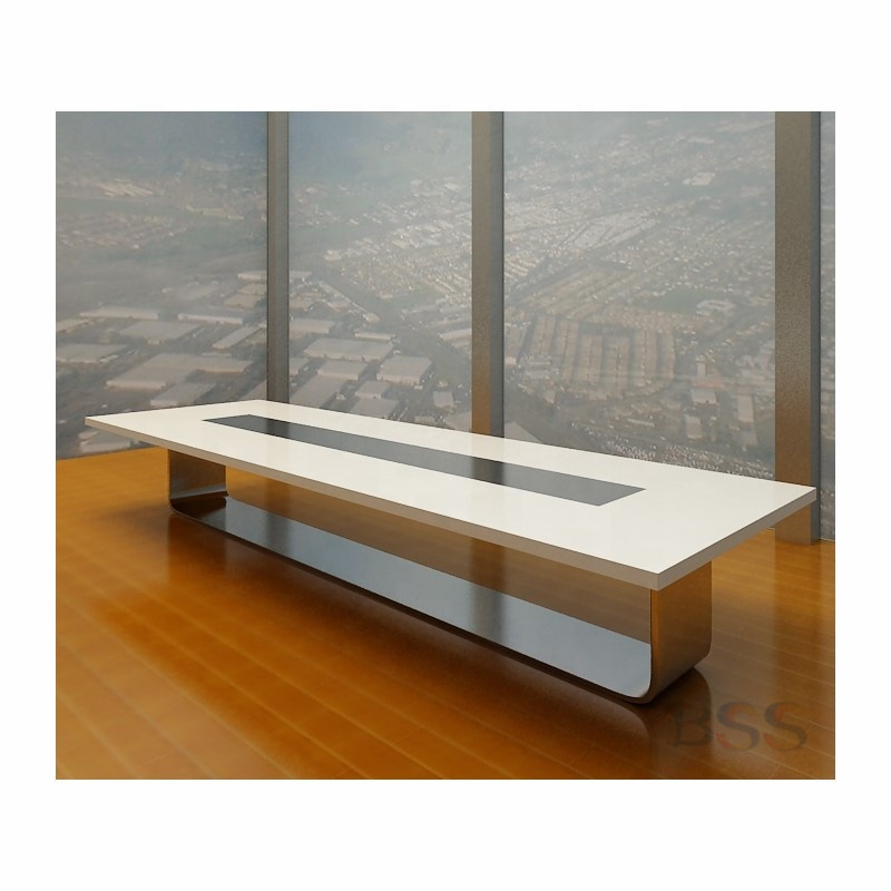 Modern white conference table setup with seating