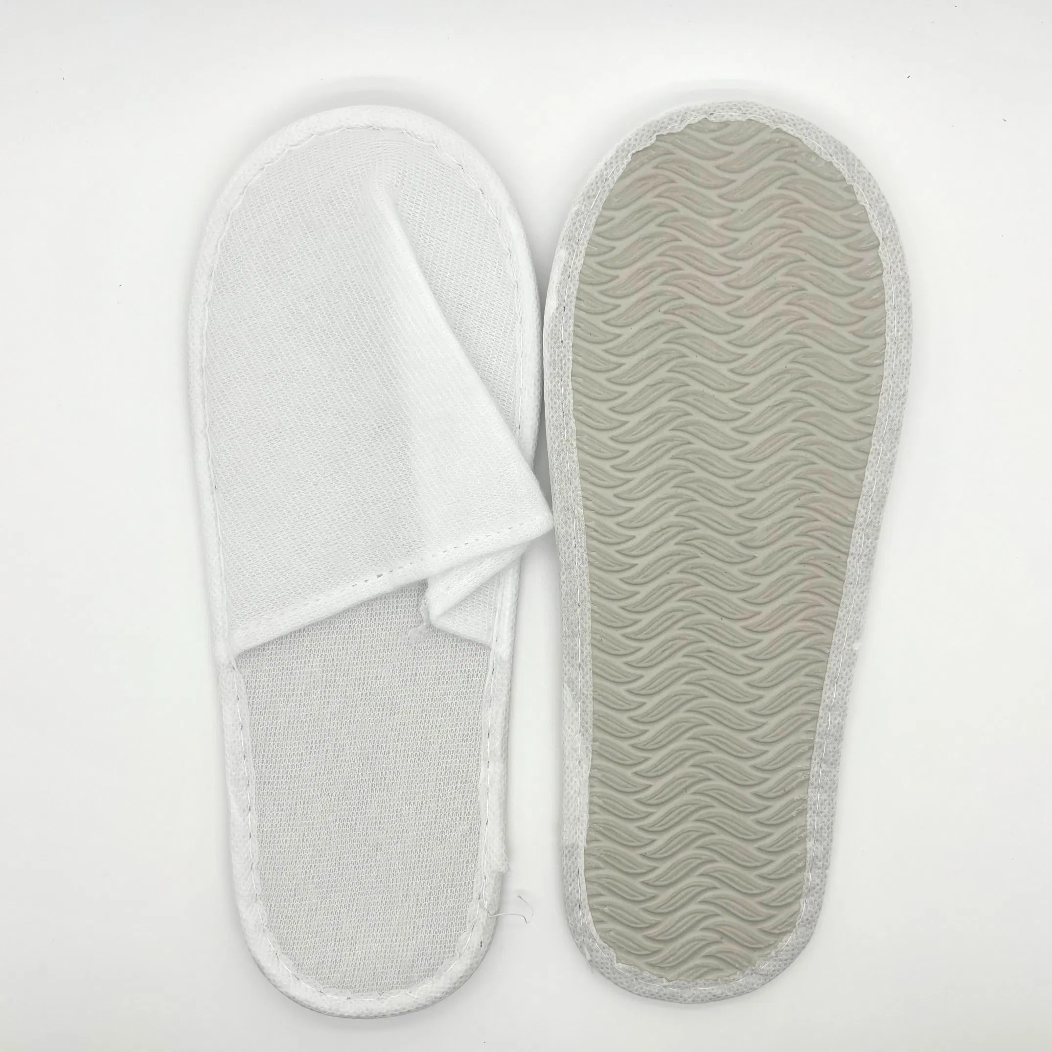 Zapatillas de hotel cómodas con marca personalizada para estancias de lujo