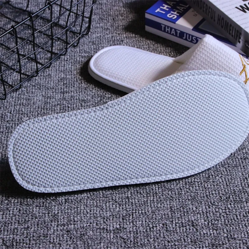 Zapatilla desechable de tela waffle con suela EVA ecológica para hotel, antideslizante, resistente al desgaste, se puede utilizar para hotel, viaje, resort y spa