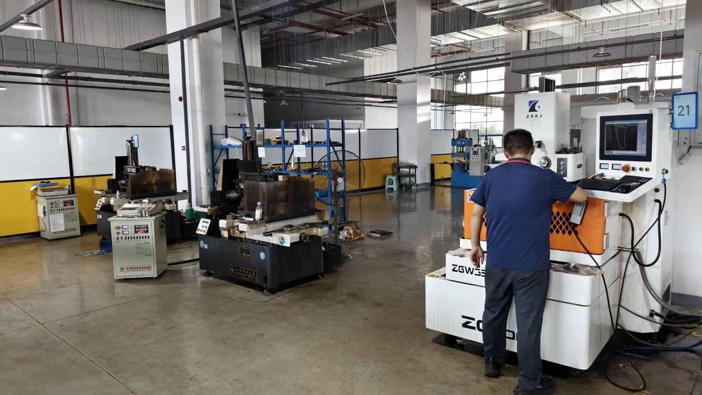Wire cutting machine for precision orthopedic implant component manufacturing